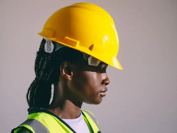 A MINEDADA team member on site, reflecting the organisation's multidisciplinary, people-first approach